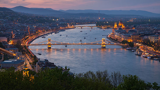 A view of the Charles Bridge and Prague Castle on a foggy morning in the Czech Republic.